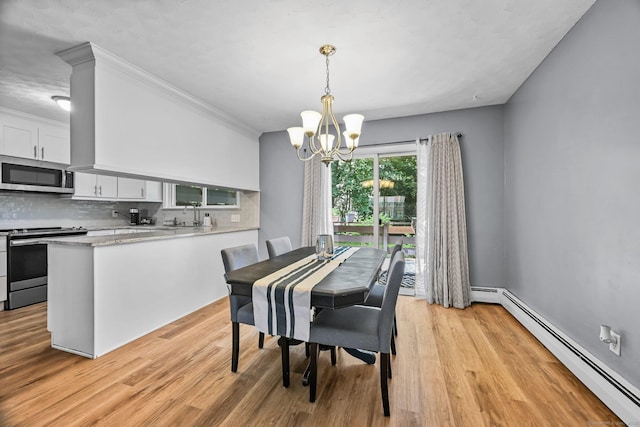 333 Vincellette St Unit 25, Bridgeport, CT 06606 - dining room featuring a baseboard radiator, a chandelier, and light wood-type flooring