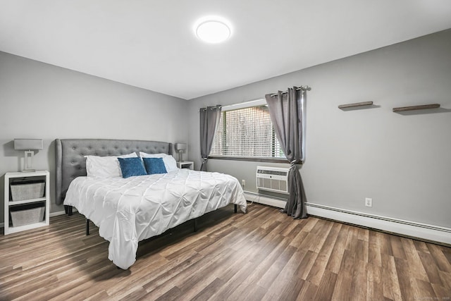 333 Vincellette St Unit 25, Bridgeport, CT 06606 - bedroom with wood finished floors, baseboard heating, a wall unit AC, and baseboards