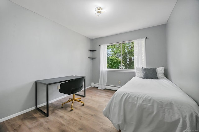 333 Vincellette St Unit 25, Bridgeport, CT 06606 - bedroom with baseboard heating, wood finished floors, and baseboards