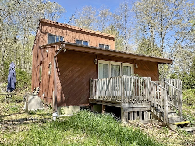 back of house with a wooden deck