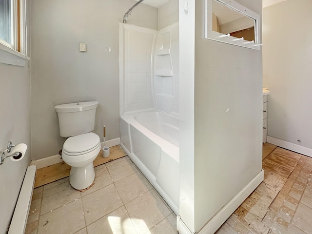 bathroom featuring shower / bathtub combination, toilet, baseboards, and vanity