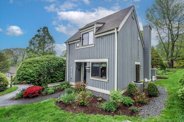 view of front of home featuring roof with shingles