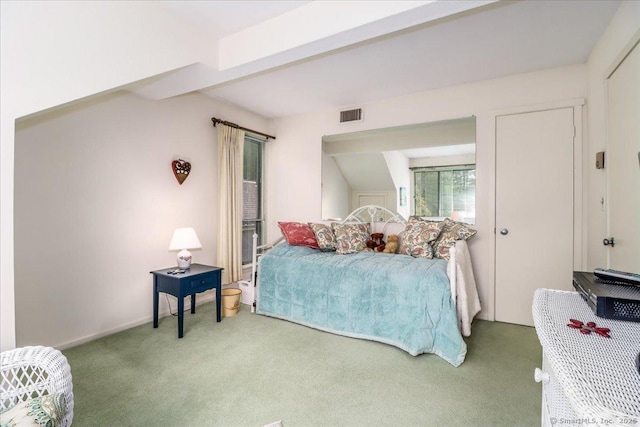 carpeted bedroom featuring baseboards
