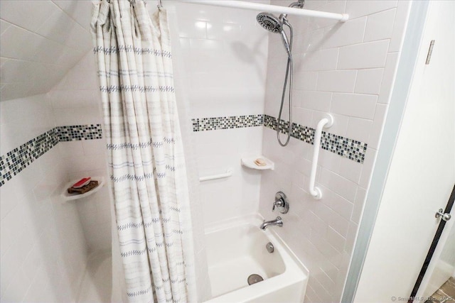 full bathroom with shower / bath combination with curtain and tile walls