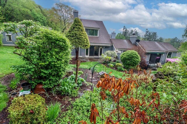back of property featuring a chimney