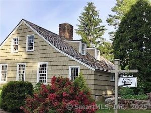 view of side of home with a chimney