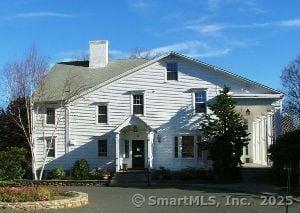 view of front of home featuring a chimney