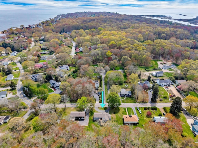 bird's eye view with a water view and a view of trees