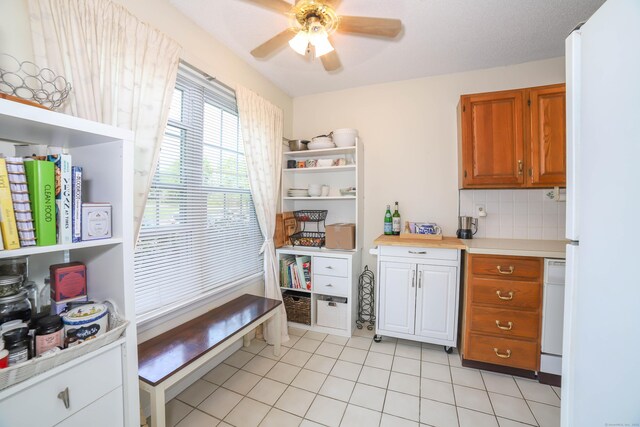 kitchen with a ceiling fan, light tile patterned floors, white appliances, open shelves, and light countertops