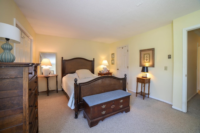 bedroom with carpet and baseboards