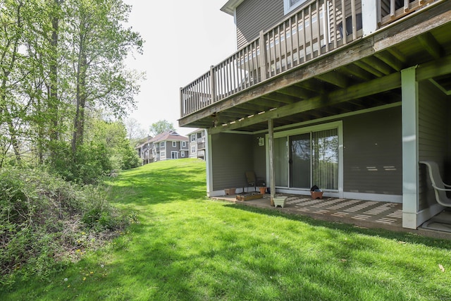 view of yard with a patio and a wooden deck