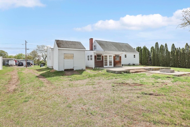 327 Abbe Rd, Enfield, CT 06082 - back of house featuring french doors, a patio, a lawn, and a fire pit