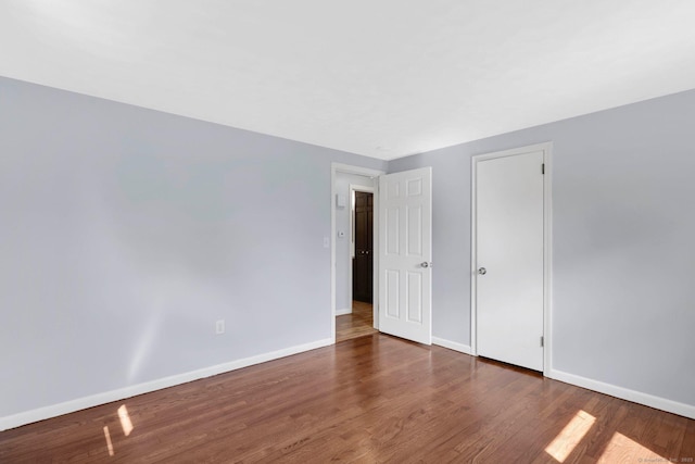 327 Abbe Rd, Enfield, CT 06082 - unfurnished bedroom featuring baseboards and wood finished floors