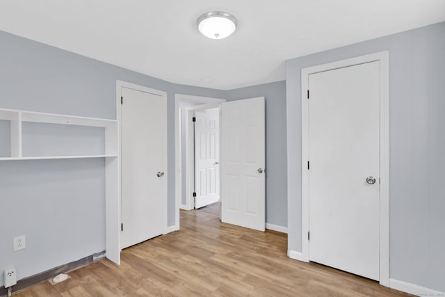 327 Abbe Rd, Enfield, CT 06082 - unfurnished bedroom featuring baseboards and wood finished floors