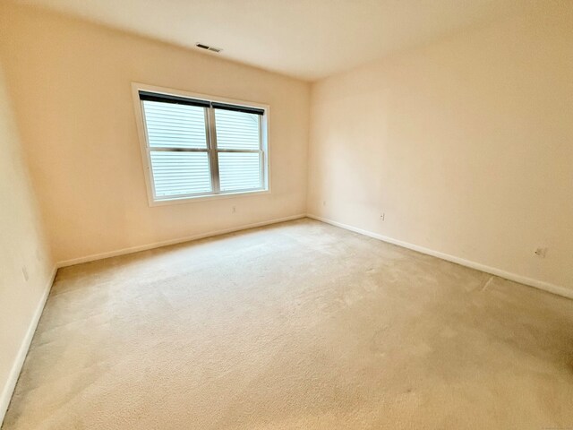 253 Summerfield Gdns Unit 253, Shelton, CT 06484 - spare room featuring light carpet and baseboards