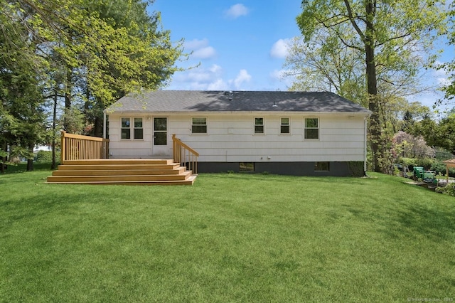 128 W Ave, Darien, CT 06820 - rear view of house featuring a deck, a lawn, and a shingled roof