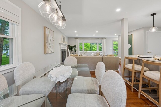 128 W Ave, Darien, CT 06820 - dining space with wood finished floors, a fireplace, and recessed lighting