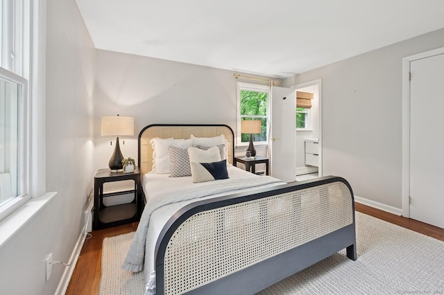 128 W Ave, Darien, CT 06820 - bedroom with wood finished floors and baseboards