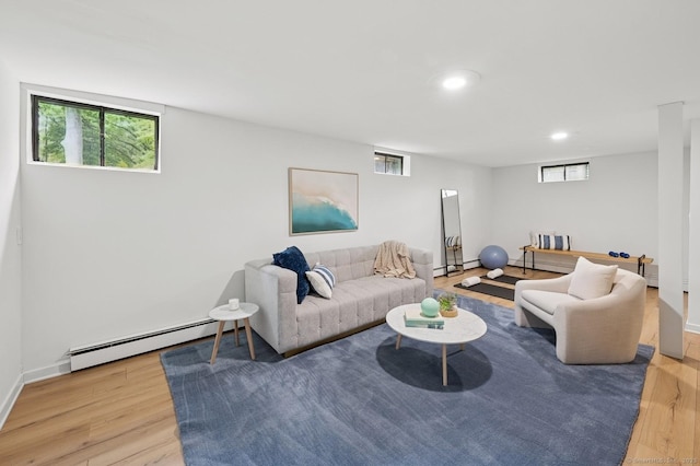 128 W Ave, Darien, CT 06820 - living area featuring a baseboard radiator, wood finished floors, healthy amount of natural light, and recessed lighting