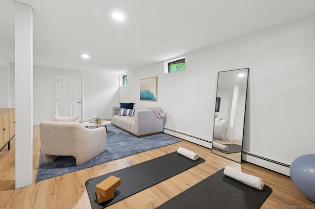 128 W Ave, Darien, CT 06820 - workout room with a baseboard radiator, wood finished floors, and recessed lighting
