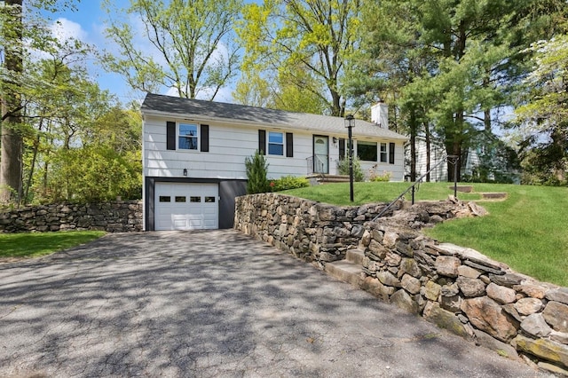 128 W Ave, Darien, CT 06820 - ranch-style house featuring a chimney, asphalt driveway, an attached garage, and a front lawn
