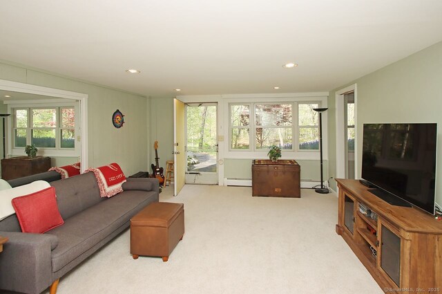 living room with baseboard heating, a baseboard radiator, light carpet, and recessed lighting