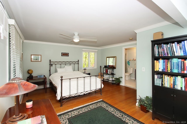 bedroom featuring ceiling fan, ornamental molding, and wood finished floors