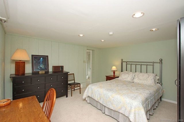 bedroom with recessed lighting and light carpet