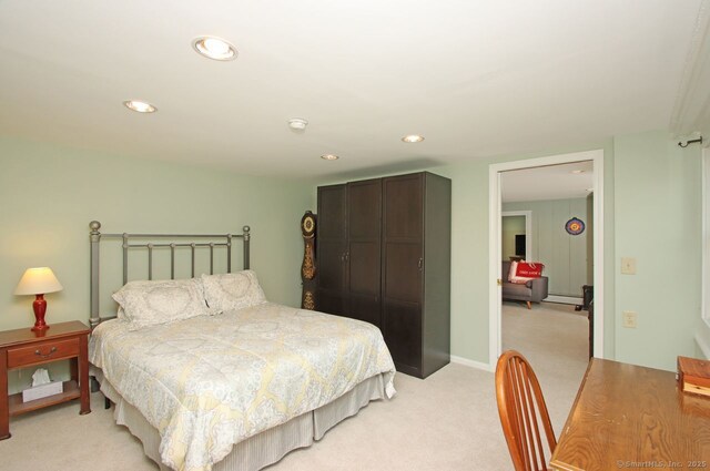 bedroom with recessed lighting and light colored carpet