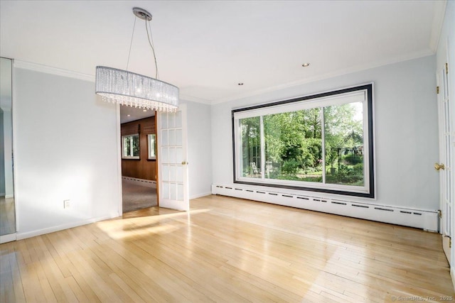 110 Deer Hill Ave, Danbury, CT 06810 - empty room featuring hardwood / wood-style floors, a baseboard radiator, crown molding, baseboard heating, and baseboards