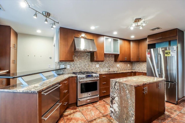 110 Deer Hill Ave, Danbury, CT 06810 - kitchen featuring appliances with stainless steel finishes, wall chimney range hood, a peninsula, a sink, and tasteful backsplash