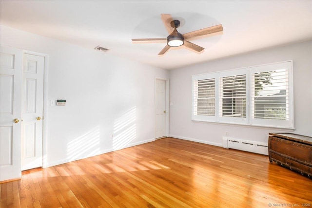 110 Deer Hill Ave, Danbury, CT 06810 - spare room featuring a baseboard radiator, light wood finished floors, ceiling fan, and baseboards