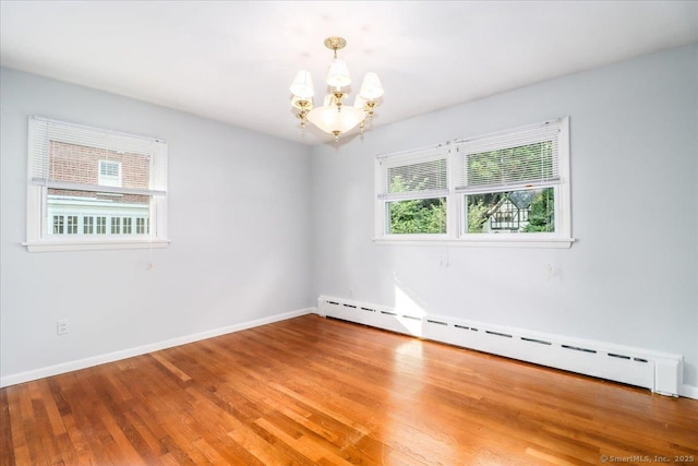 110 Deer Hill Ave, Danbury, CT 06810 - unfurnished room featuring baseboard heating, a chandelier, wood finished floors, and baseboards