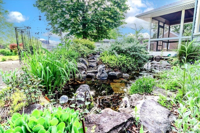 110 Deer Hill Ave, Danbury, CT 06810 - view of yard featuring a sunroom and a garden pond