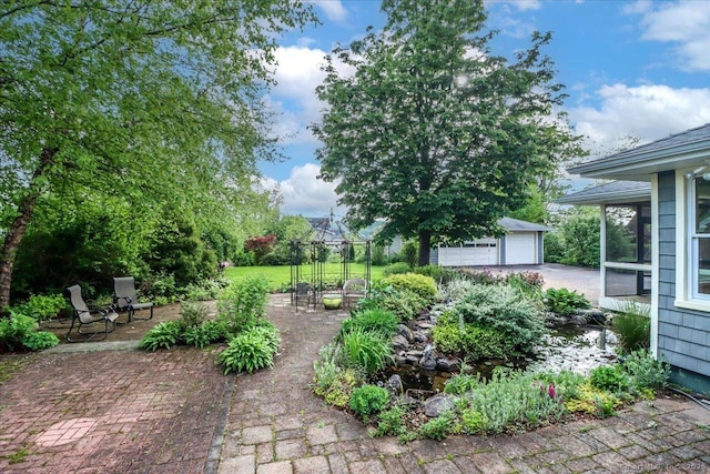 110 Deer Hill Ave, Danbury, CT 06810 - view of yard with a garage, an outbuilding, and a patio area