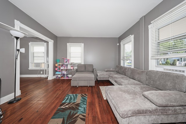 224 1st Ave, West Haven, CT 06516 - living area with wood finished floors, healthy amount of natural light, baseboards, and cooling unit