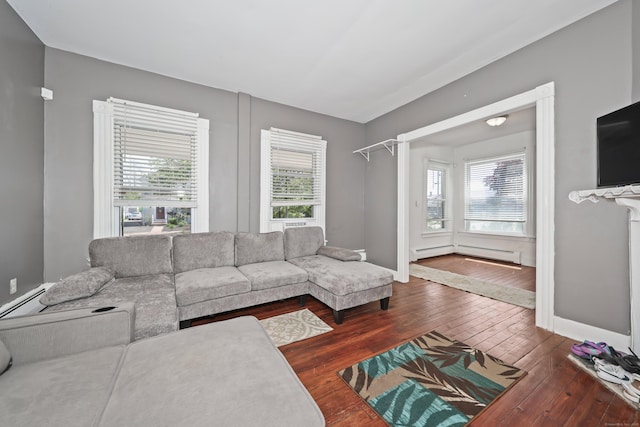 224 1st Ave, West Haven, CT 06516 - living room featuring dark wood finished floors, a baseboard heating unit, plenty of natural light, and baseboards