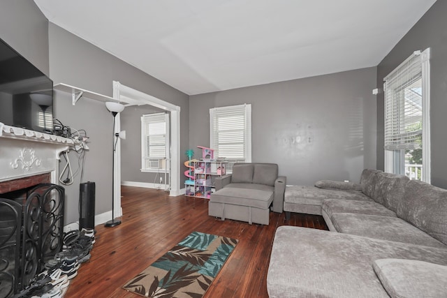 224 1st Ave, West Haven, CT 06516 - living room with hardwood / wood-style flooring, a brick fireplace, and baseboards