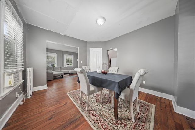 224 1st Ave, West Haven, CT 06516 - dining room featuring wood finished floors, baseboards, radiator heating unit, and cooling unit
