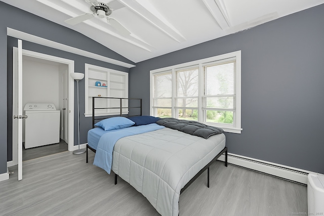 224 1st Ave, West Haven, CT 06516 - bedroom with washer / clothes dryer, baseboard heating, light wood finished floors, and baseboards