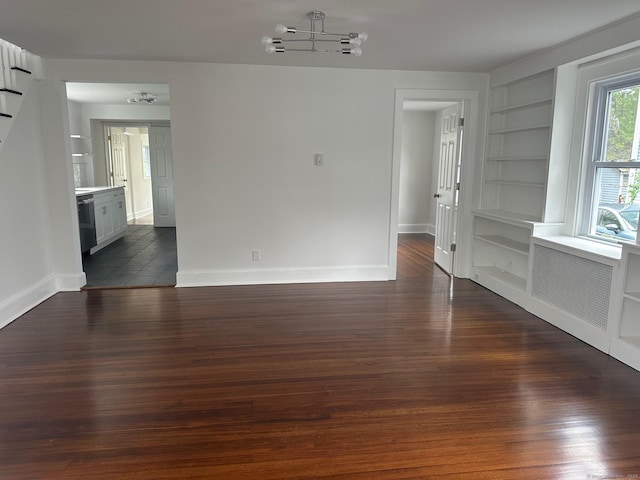 14 Sherman St, Stamford, CT 06902 - unfurnished dining area featuring dark wood-type flooring, built in features, and baseboards