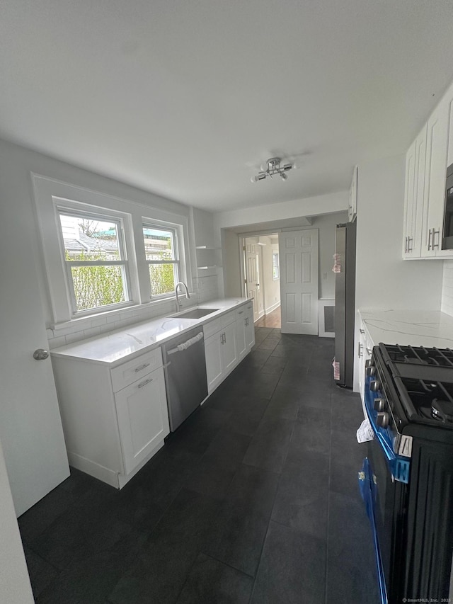 14 Sherman St, Stamford, CT 06902 - kitchen with a sink, appliances with stainless steel finishes, light stone counters, and white cabinetry