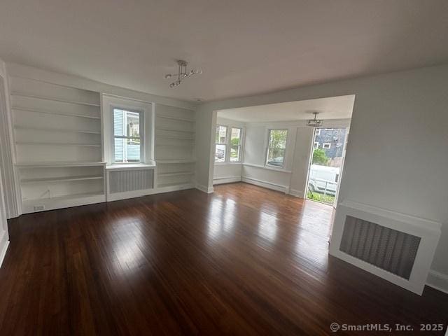 14 Sherman St, Stamford, CT 06902 - interior space with baseboards, radiator, wood finished floors, and built in features