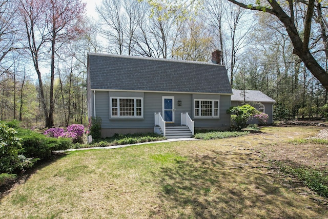 7 Partridge Ln, Burlington, CT 06013 - colonial inspired home with a chimney, roof with shingles, and a front lawn
