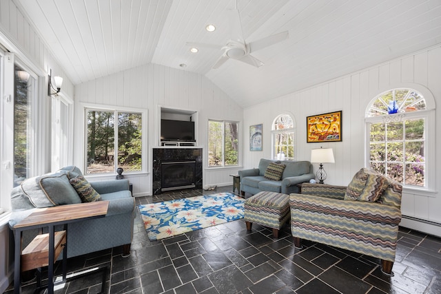 7 Partridge Ln, Burlington, CT 06013 - living area featuring vaulted ceiling, stone tile floors, a ceiling fan, a premium fireplace, and recessed lighting