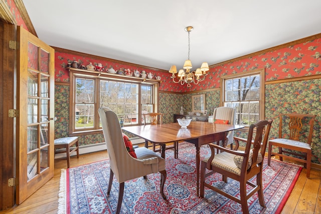 7 Partridge Ln, Burlington, CT 06013 - dining room with wallpapered walls, a chandelier, plenty of natural light, and hardwood / wood-style floors