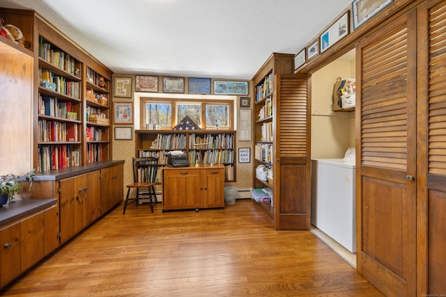 7 Partridge Ln, Burlington, CT 06013 - sitting room with washer / dryer, light wood-style flooring, a baseboard radiator, wallpapered walls, and a textured ceiling