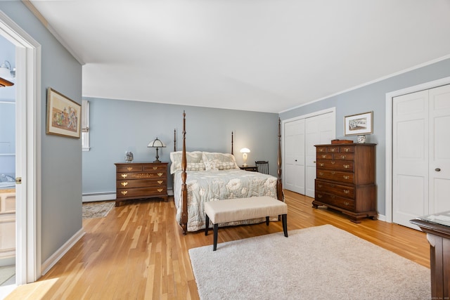 7 Partridge Ln, Burlington, CT 06013 - bedroom with baseboard heating, multiple closets, light wood-type flooring, crown molding, and baseboards