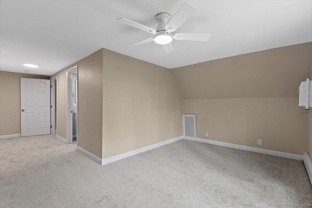 bonus room with light carpet, ceiling fan, baseboards, and lofted ceiling