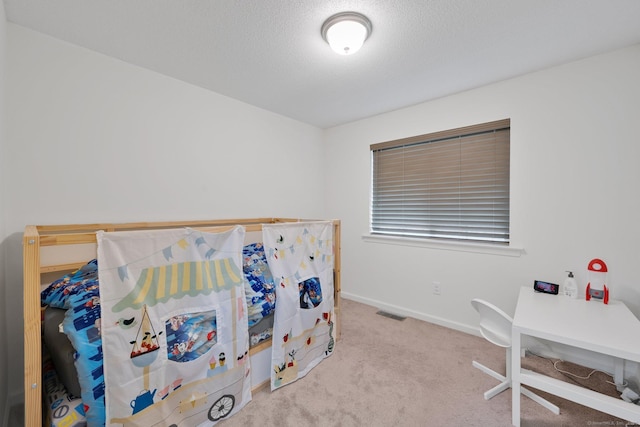 carpeted bedroom with baseboards